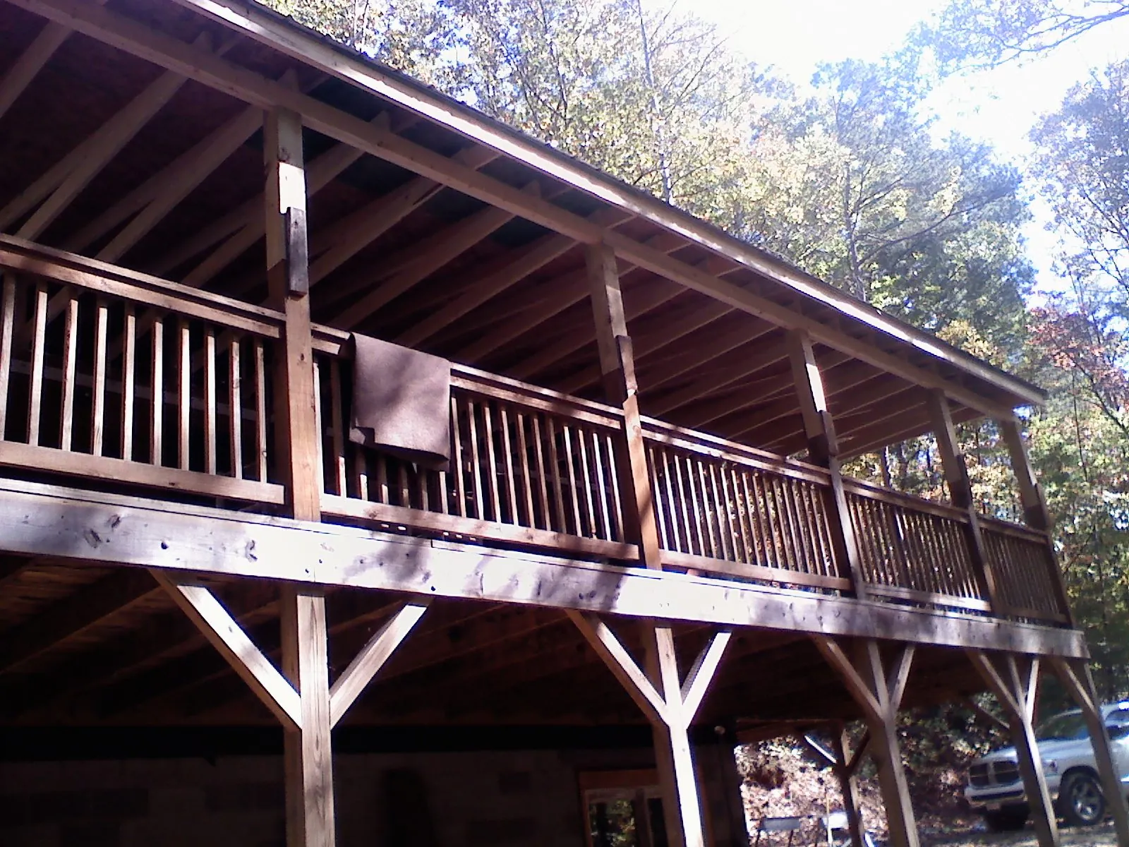 Timber framing under a new elevated porch and deck — Roof Leak Repair in North Waterboro by Roofing Brothers